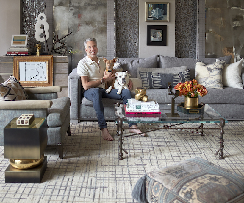 Thom Filicia in his living room with his two dogs